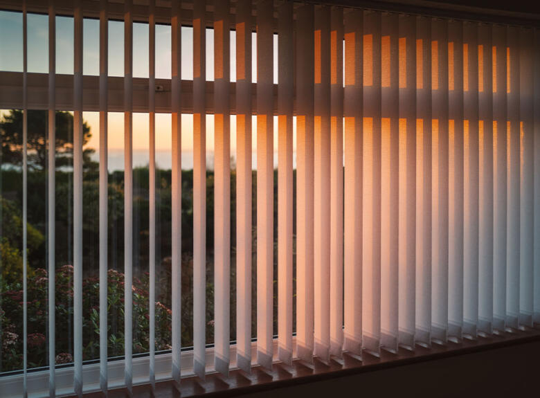 Sunset through vertical blinds
